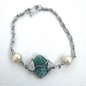 Bracelet. Silver Tone with Light Blue Stone Pendant. Handmade from South America